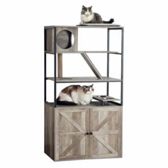 Two cats sitting on a multi-level wooden cat furniture shelf with storage cabinet.