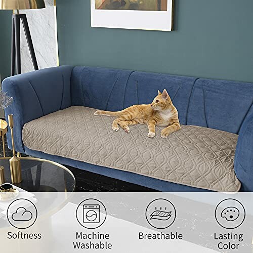 Cat lying on a quilted sofa cover with icons for softness, machine washable, breathable, lasting color.