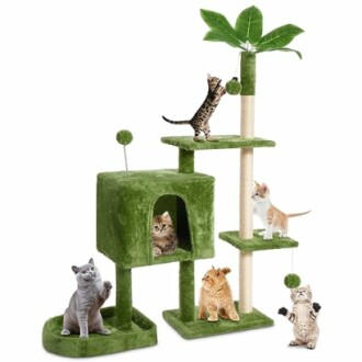 Cats playing on a green cat tree with multiple levels and toys.