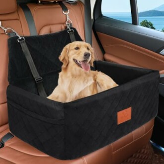 Golden retriever sitting in a black car seat cover