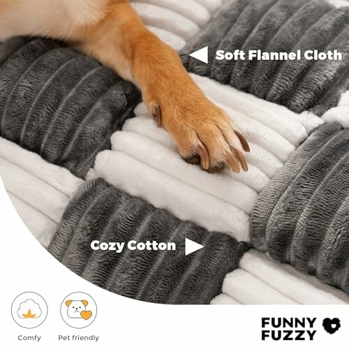 Dog paw resting on a soft flannel and cotton blanket.