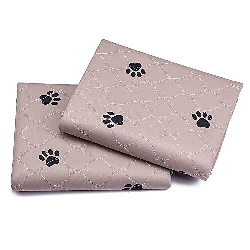 Two folded blankets with black paw print pattern on a beige background.