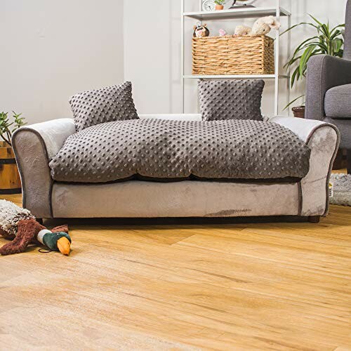 Plush dog bed with pillows in living room setting