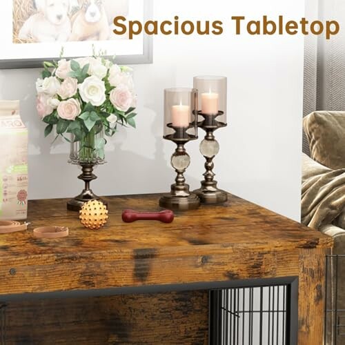 Wooden table with flowers, candles, and decor items.