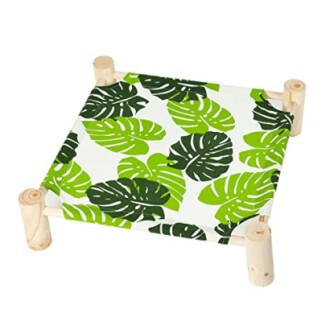 Wooden elevated pet bed with green leaf pattern